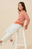 GK1361 Rust Girls Striped Kangaroo Pocket Knit Long Sleeve Henley Pose