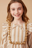 GK1447 MUSTARD Girls Textured Stripe Tasseled Bodice Top Detail